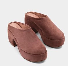 Slip into these ultra-chunky mules, the perfect mix of retro flair and modern comfort. Wrapped in soft suede, they feature a bold platform and block heel that give you height without sacrificing comfort. The minimalist design makes them super versatilewhether you're dressing up or keeping it casual, these mules are the perfect off-duty staple to complete your look Chunky Mules, The Minimalist, Soft Suede, Off Duty, Minimalist Design, Best Sellers, Block Heels, Clogs, Dress Up