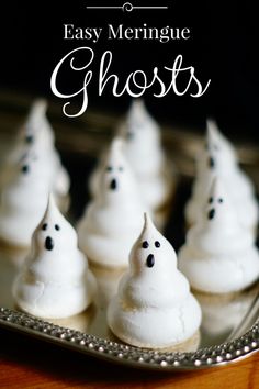 small white ghost cupcakes on a silver plate with the words easy meringue ghosts