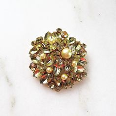 "This is a fabulous yellow rhinestone & faux pearl brooch signed Alice Caviness. The stones are set into yellow gold toned settings. The pin back is secure. There are 4 stones that have dark spots in them. All stones are present & secure. The brooch measures 1 3/4\" in diameter. The back is signed. This is a vintage, previously owned brooch. Therefore, light wear can be expected." Gold Jeweled Brooches For Party, Vintage Gold Brooches With Rhinestones, Gold Jeweled Costume Jewelry Brooch, Gold Jeweled Brooches For Wedding, Round Solitaire Diamond Necklace, Carved Ring, Sterling Silver Rings Bands, Gold Brooches, Silver Work