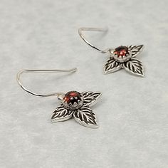 Adorn your ears with ready-to-bloom rose bud leaf earrings that glow with the radiant red of garnets. Crafted by hand from recycled sterling silver, deeply etched and oxidized rose leaves are clustered together and set with bright Orissa garnets. These rose leaf garnet earrings suspend from sterling silver ear wires. Earstuds Sterling Silver Gold Roses Red Green, 14kt Gold Jewelry, Rose Leaf, Radiant Red, Rose Leaves, Rose Bud, Local Jewelry, Garnet Earrings, Cluster Earrings