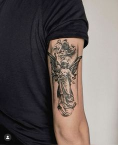 a man with a tattoo on his arm