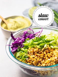 a glass bowl filled with vegetables and dressing