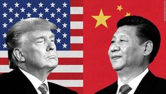 two men standing next to each other in front of an american and chinese flag with the same image on it