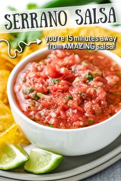 a white plate topped with salsa and tortilla chips