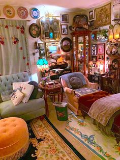 a living room filled with lots of furniture and decor