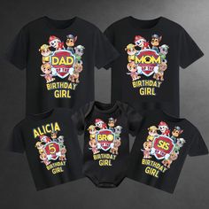 three baby onesuits with cartoon characters printed on the front and back, all in black