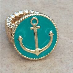 Gold Tone Rings Features A Round Disc With A Nautical Anchor At The Center, A Turquoise Enamel Background And A Twisted Rope Texture Design Along The Outside. Super Fun Ring Is Elastic And Is One Size Fits Most. Ring Measures 5/8 Inch In Size. Rope Texture, Stretch Ring, Nautical Anchor, Rings Cool, Texture Design, Ring Gold, Womens Jewelry Rings, Adjustable Rings, Blue Gold