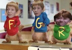 three young children wearing funny outfits in the shape of chipmuns with letters on them