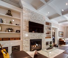 a living room filled with furniture and a fire place in front of a flat screen tv