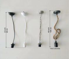 three different types of cords hanging from hooks on the wall, one with a cord attached to it