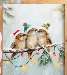 a painting of three birds sitting on a branch with christmas lights in the foreground