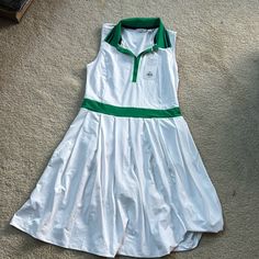 Lady Hagen White And Green Golf/Tennis Dress With Underlying Short. Slight Pleat To Skirt. Fits Larger, Like A Medium. May Fit A Large As Well. Unworn. New With Tag. Fitted White Tennis Dress With Short Sleeves, Green Tennis Dress For Summer, Green Tennis Skirt For Summer, Green Summer Tennis Dress, Sleeveless Green Tennis Dress For Spring, Casual Green Tennis Dress For Spring, White Short Sleeve Tennis Dress, Preppy Tennis Skirt For Summer, Preppy Fitted White Dress