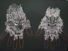 two drawings of hands with intricate designs on them