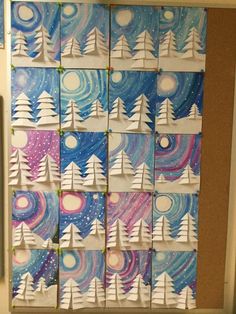 a bulletin board made out of paper with trees and stars in the sky on it