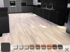 an image of a modern kitchen with wood flooring and black cabinets in the background