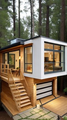 a small house in the woods with stairs leading up to it's second floor