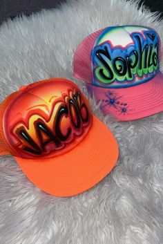 Designs by Galveston Airbrush! ♡ Feel free to contact me with any questions or custom orders. ✧ Our Designs on these Trucker hats are handmade with the artists' skilled Hands and that makes each item unique ✧ My designs are Airbrushed on multicolor trucker hats. Please select desired color from the drop-down menu. Each design includes up to TWO names or words with up to THREE specified COLORS. SIZES: One Size for ADULTS DESIGN PLACEMENT: All designs are airbrushed on the FRONT of our cute hats u Fun Orange Adjustable Hat, Customizable Red Trucker Hat With Curved Brim, Custom Adjustable Snapback Baseball Cap, Fun Orange Snapback Hat, Customizable Cap Hats, Custom Adjustable Snapback Hat With Flat Bill, Red Customizable Adjustable Hat, Customizable Trucker Snapback Hat For Beach, Personalized Snapback Hat For The Beach