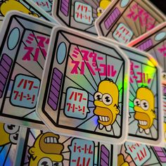 the simpsons stickers have been placed on top of each other