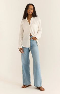 You'll love the easy, breezy comfort of this classic linen button-up. With its soft, drapey feel, you can throw it on over a tank, swim suit or bralette for an effortless look no matter where you are. Relaxed fit Textured Linen Rayon: 55% Linen, 45% Linen Collared Button front Left front chest pocket Raglan sleeves Machine wash cold, Hang to dry, Cool iron if needed White Linen Top, Silk Bottoms, Linen Romper, White Floral Dress, Strapless Tops, Linen Shop, Loungewear Sets, Easy Breezy, Party Tops