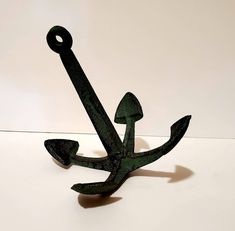 an anchor made out of metal sitting on a table