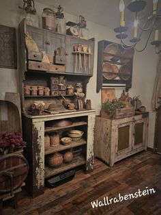 an old fashioned kitchen with lots of pots and pans