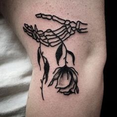 a black and white photo of a tattoo on the arm