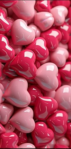 a pile of pink and white heart shaped candies