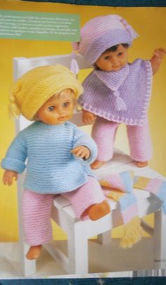 an image of two dolls in knitted clothes on a doll's rocking chair