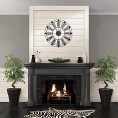 a living room with a fire place and zebra rug