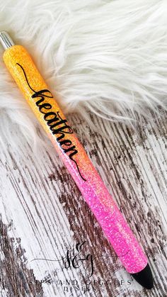 a pink and yellow pen sitting on top of a white fur covered floor