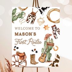 a welcome sign for mason's first rodeo is displayed on a easel in front of a boket background