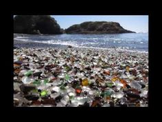 a beach covered in lots of glass bottles