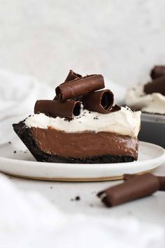 a slice of chocolate cream pie on a white plate