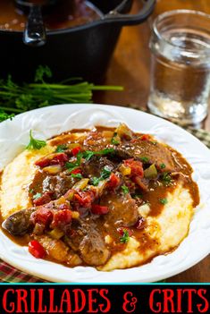 a white plate topped with mashed potatoes covered in gravy