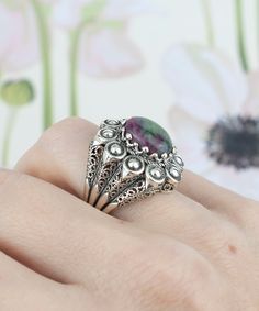 This exquisite embroidery dome ring is handcrafted and oxidized with the highest quality materials. The 925 sterling silver dome ring is filigree art designed and oxidized for an antique look. The natural Ruby Zoisite gemstone is a 10x12 mm cabochon oval-cut, set in a bezel setting. The ring face length is 0.9 inches / 22.50 mm and width is 0.80 inches / 20.00 mm.  It comes with a velvet pouch, silver polish cloth and a luxurious gift box, making it the perfect option for any occasion - Mother's Day gift, thanksgiving gift, Christmas gift, birthday gift - you name it!          This ring is an absolute stunner! With its intricate filigree details and beautiful red - green ruby zoisite gemstone, this ring is perfect for any occasion. It's also handmade with love, so you know it's a quality p Oxidized Finish Filigree Ring For Gift, Vintage Round Filigree Ring With Oxidized Finish, Ornate Sterling Silver Filigree Ring With Oxidized Finish, Handmade Victorian Sterling Silver Filigree Ring, Antique Handmade Filigree Ring, Handmade Antique Filigree Ring, Antique Handmade Round Filigree Ring, Bohemian Oval Filigree Ring With Intricate Design, The Ring Face