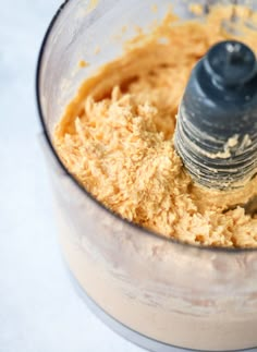 a food processor filled with batter and butter