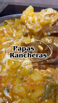 a spoon full of food with the words papas rancheras above it