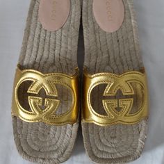 All Of My Items Are Guaranteed 100% Authentic You Are Looking At A Beautiful Designer Pair Of Sandals Made By Gucci Size 39.5 And 40 Heels .75" Leather Uppers And Accented With Cut Out Interlocking Ggs Brand New With Box, Gucci Cards And Dust Bag Gucci Perforated G Sandal, Gucci Slide Heels, Designer Gold Closed Toe Sandals, Designer Gold Sandals With Round Toe, Designer Gold Sandals For The Beach, Gucci Luxury Flat Heel Sandals, Luxury Gold Slip-on Sandals, Gucci Gold Open Toe Sandals, Gucci Gold Designer Sandals