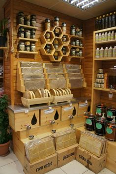 the shelves are filled with honey and other items for sale in the store's display area