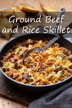 ground beef and rice skillet in a pan with a spatula on the side