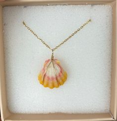 The necklace pictures is made from a natural sunrise shell from the islands of Hawai'i. The shell is wrapped with gold filled wire and secured in place. The necklace provided is a 18K gold filled necklace, 16 inches long. Please be sure to look at the measurements listed for each shell, as each shell differs slightly in size and color.  Sunrise shells are one of the most colorful and beautiful shells found on the Islands of Hawaii. They come in various and vibrant colors including lots of pinks, Necklace Pictures, Islands Of Hawaii, Sunrise Shell, Beautiful Shells, Gold Filled Necklace, Shell Necklace, Hawaiian Islands, Shell Necklaces, Favorite Jewelry