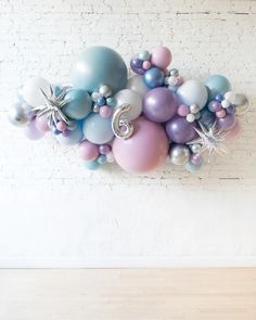 a bunch of balloons that are on the wall