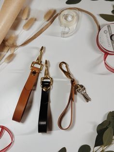 This is the perfect wristlet used to hold all your keys, with the brass hook also allowing the ability to secure your keys in your purse if you so choose! Gold Adjustable Wristlet For Everyday Use, Adjustable Wristlet With Key Leash For Daily Use, Brown Keychain With Key Leash For Everyday Use, Gold Wristlet With Wrist Strap For Everyday Use, Adjustable Wristlet With Keychain For Everyday Use, Daily Use Wristlet With Key Leash, Gold Keychain With Key Leash For Everyday Use, Gold Keychains With Key Clip For Everyday Use, Gold Keychain With Key Clip For Everyday