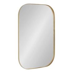 a gold framed mirror on a white background