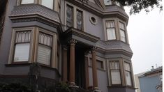 an old house with many windows and balconies