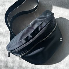 Nwot Lululemon City Adventurer Belt Bag 2.5l New Without Tags, No Flaws. Purchased This Year For A Trip And Didn’t End Up Using It. Ships Same Day Or Next Business Day - Pet And Smoke Free Home Color: Black Bag Dimensions: 28cm X 7.5cm X 17cm (11" X 3" X 6.7") Strap Length When Fully Extended: 100cm (39.4") Volume: 2.5l Water Repellent Fabric Adjustable Strap Zippered Exterior Pockets Interior Pockets To Organize Your Small Items Of Importance Bag: 100% Nylon Mesh: 100% Recycled Polyester Lining Lululemon Wanderlust Belt Bag, Home Color, Water Repellent Fabric, Black Bag, Small Items, Belt Bag, Water Repellent, Black Silver, Lululemon Athletica