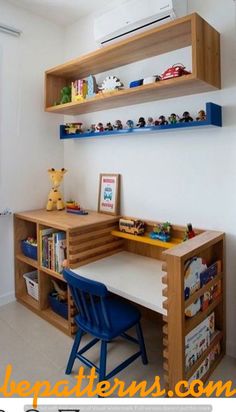 a wooden desk with shelves above it and a blue chair in front of the desk