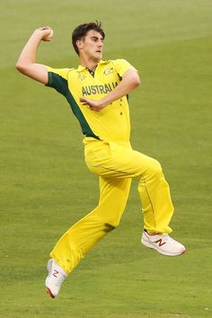 a male in a yellow uniform is throwing a ball