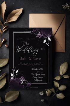 an elegant wedding card with purple flowers and leaves