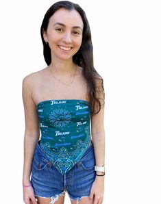 The must have top for all Tulane fans! Our super flattering Tulane Bandana Top is the perfect top for all occasions. With double lining and and an adjustable tie back, this top provides side coverage and a second layer around the chest to make it a perfect fit! Our top's soft and stretchy material will make you never want to take it off! Pair with your favorite pair of jeans or our Tulane Game Day Skirt for the cutest outfit! In stock & ships in 1-2 business days. One Size Fits Most. Double Green Stretch Tie Back Top, Green Stretch Tops With Tie Back, Green Stretch Top With Tie Back, Stretch Tie Back Crop Top, Stretch Tie-back Crop Top, Bandeau Tie-back Top For Beach, Bandeau Tie Back Top For Beach, Bandeau Top With Tie Back For Beach, Blue Stretch Tops With Tie Back